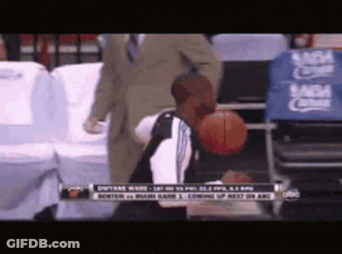 Man Holding Basketball In Front Of NBA Sign GIF