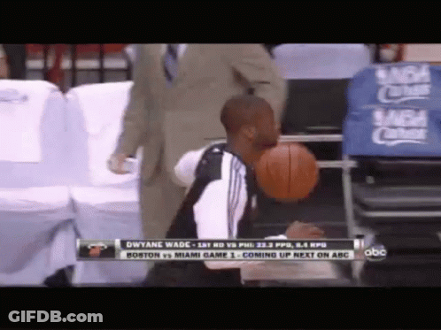 Man Holding Basketball In Mouth Watching Boston Vs Miami GIF