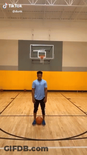 Man Holding Basketball On Court GIF