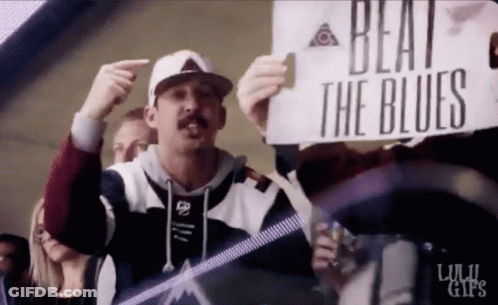 Man Holding Beat The Blues Sign GIF