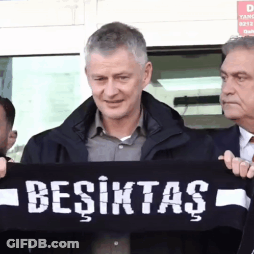 Man Holding Besiktas Scarf GIF