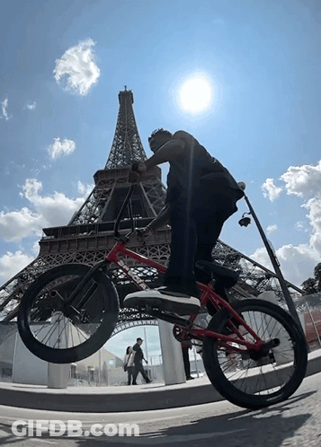 Man Holding Bike Over Head In Bike Race GIF