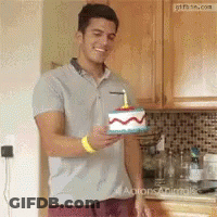 Man Holding Birthday Cake With Candle GIF