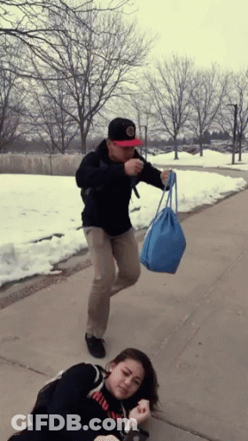 Man Holding Blue Bag While Woman Lays On Ground GIF