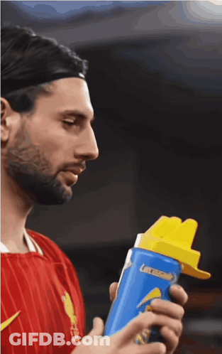 Man Holding Blue Bottle Of Gatorade GIF
