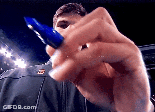 Man Holding Blue Pen With Letter E On Jacket GIF