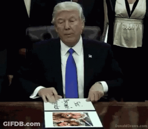 Man Holding Book Saying Donald Draws GIF