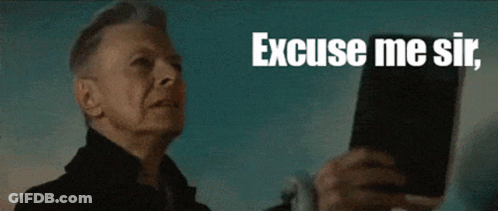Man Holding Book Saying Excuse Me Sir GIF