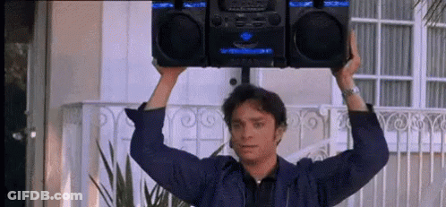 Man Holding Boombox Over Head GIF