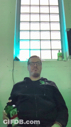 Man Holding Bottle By Window GIF