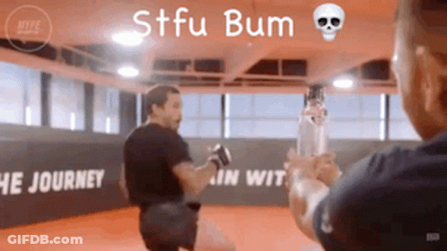 Man Holding Bottle In Gym Saying STFU Bum GIF