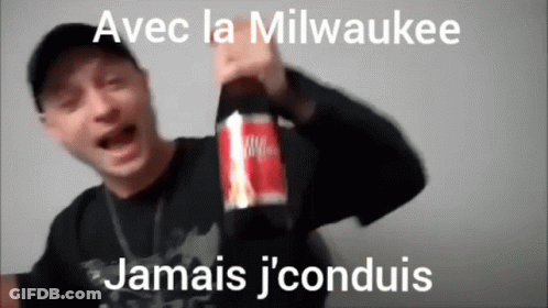 Man Holding Bottle Of Milwaukee Juice GIF