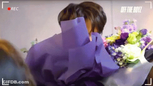 Man Holding Bouquet Of Flowers GIF