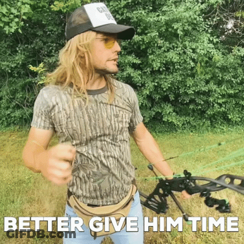 Man Holding Bow And Arrow Saying Better Give Him Time GIF
