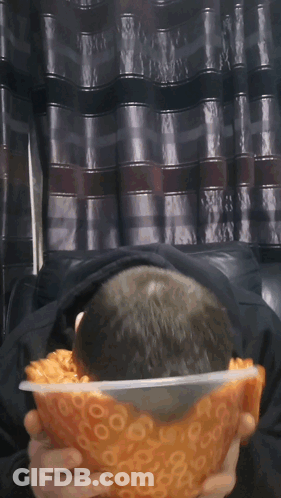 Man Holding Bowl Of Macaroni And Cheese Rings GIF