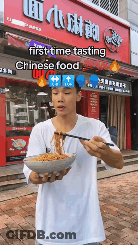Man Holding Bowl Of Noodles At Chinese Food Store GIF