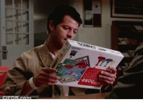 Man Holding Box Of Game Called Cowboy GIF
