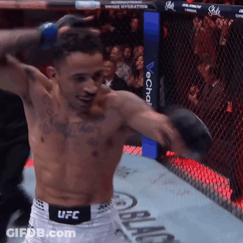 Man Holding Boxing Glove In UFC Ring GIF