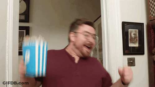 Man Holding Bucket Of Popcorn GIF