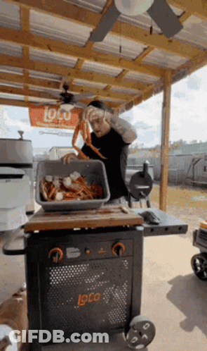 Man Holding Bucket On Head And Man On Cooler GIF