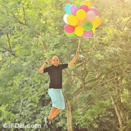 Man Holding Bunch Of Balloons GIF