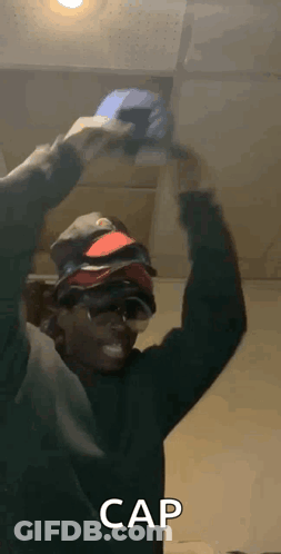 Man Holding Bunch Of Hats GIF