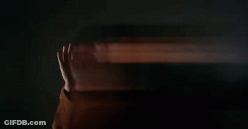 Man Holding Burning Log In Office GIF