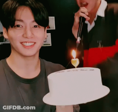 Man Holding Cake With Candle GIF