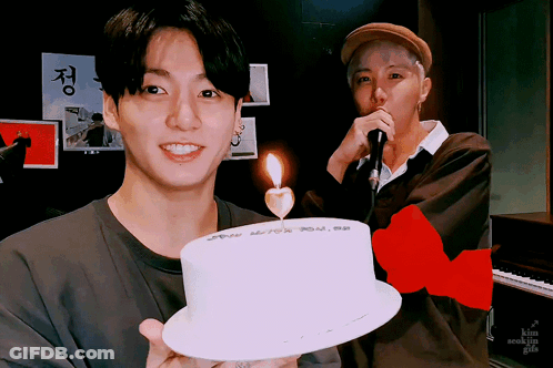 Man Holding Cake With Candle GIF