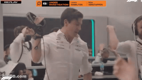 Man Holding Camera In Front Of Replay Screen GIF