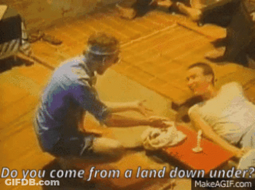 Man Holding Camera Next To Another Man In Front Of House GIF