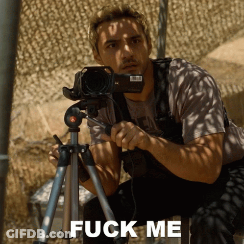 Man Holding Camera On Tripod Saying Fuck Me GIF