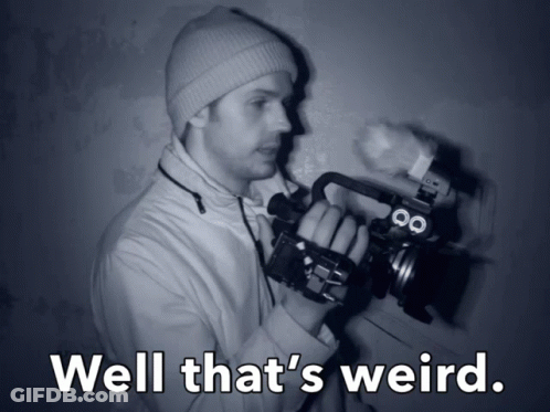 Man Holding Camera Saying Well That's Weird GIF