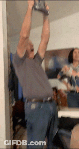 Man Holding Can Over Head GIF