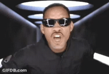 Man Holding Card Saying MIB GIF
