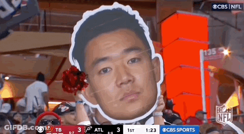 Man Holding Cardboard Face Cutout GIF