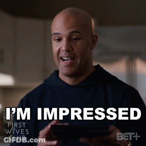 Man Holding Cell Phone Saying I'm Impressed GIF