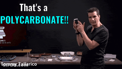 Man Holding Cellphone In Front Of That's A Polycarbonate Sign GIF