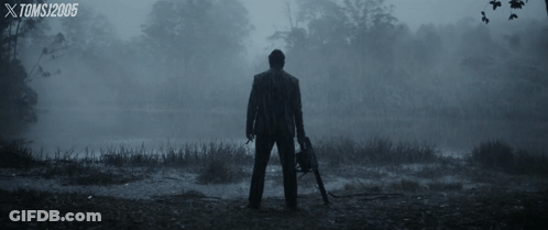 Man Holding Chainsaw In Foggy Field Toms 2005 GIF