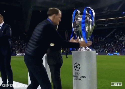 Man Holding Champions League Trophy GIF