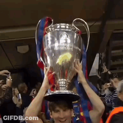 Man Holding Champions League Trophy GIF