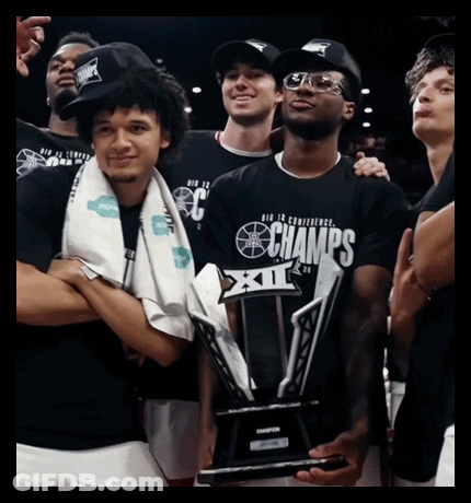 Man Holding Champions Trophy GIF