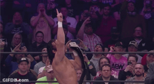 Man Holding Championship Belt GIF