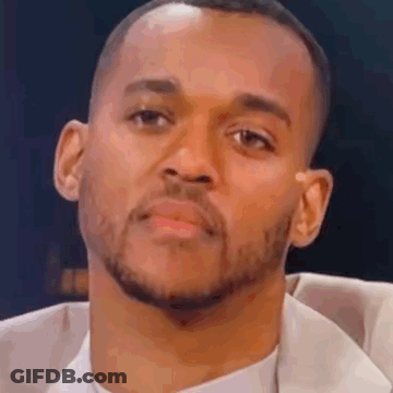 Man Holding Cheerios Cup With Spoon In Mouth GIF