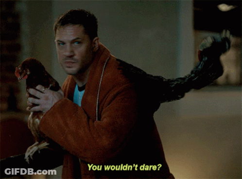 Man Holding Chicken Dare Caption GIF