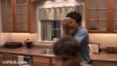 Man Holding Child In Kitchen GIF