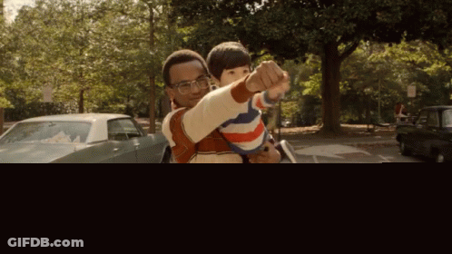 Man Holding Child In Parking Lot GIF