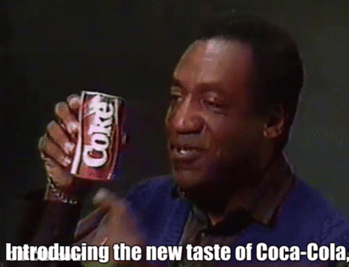 Man Holding Coca Cola Can Introducing New Taste GIF