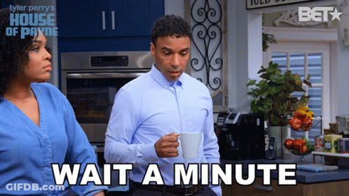 Man Holding Coffee And Woman Saying Wait A Minute GIF