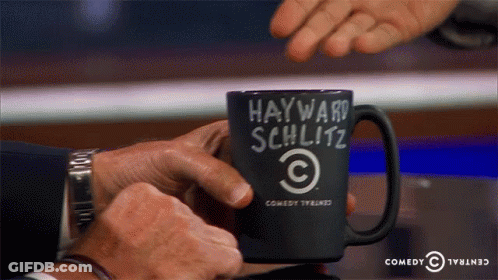 Man Holding Coffee Mug Saying Hayward Schlitz GIF
